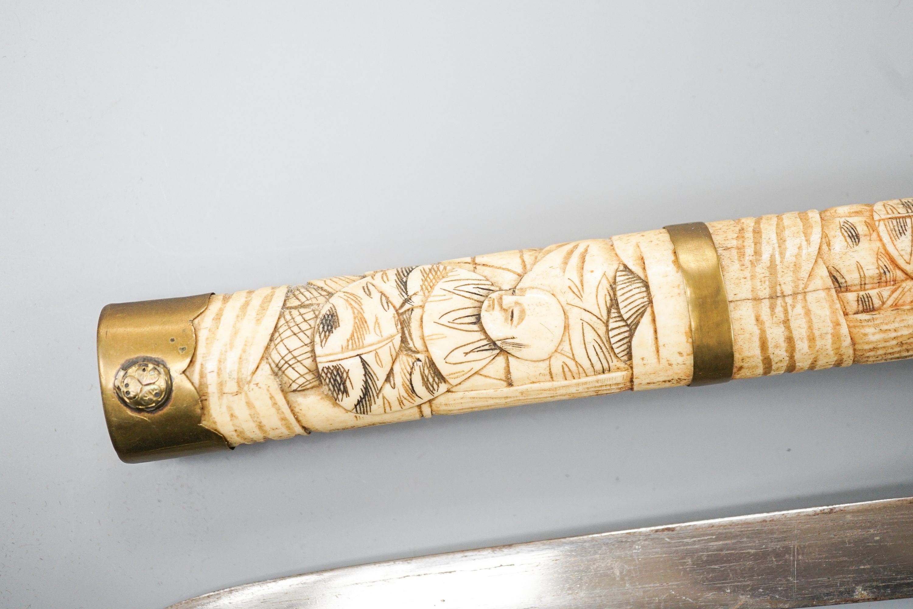 A 20th century bone and brass mounted tanto sword
